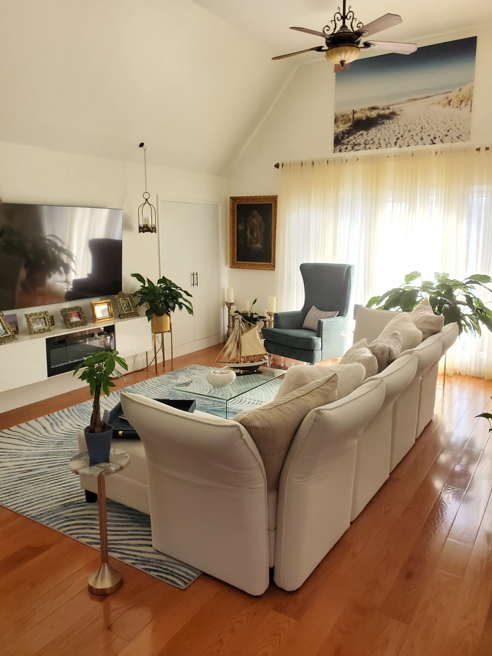 Coastal-inspired living room with layered textures, soft neutrals, and tailored seating — designed by Renata Glaz