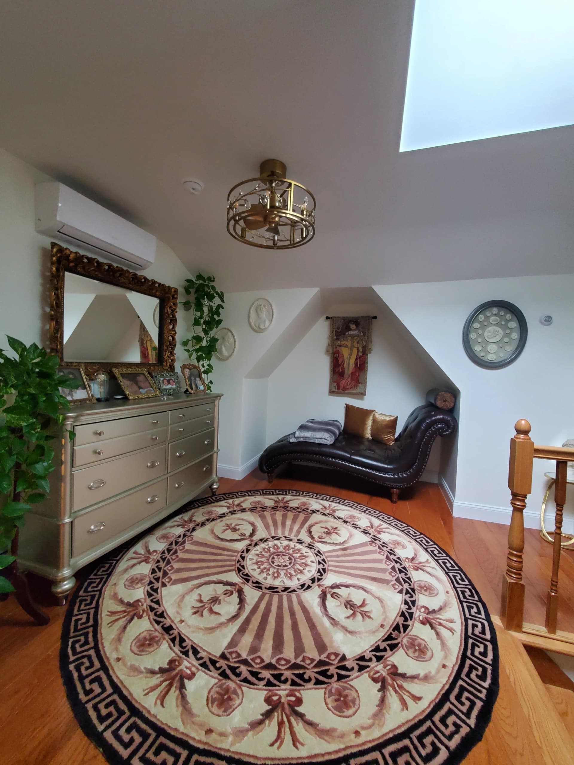 Loft retreat with sculptural chaise, ornate detailing, and moody sophistication — designed by Renata Glaz