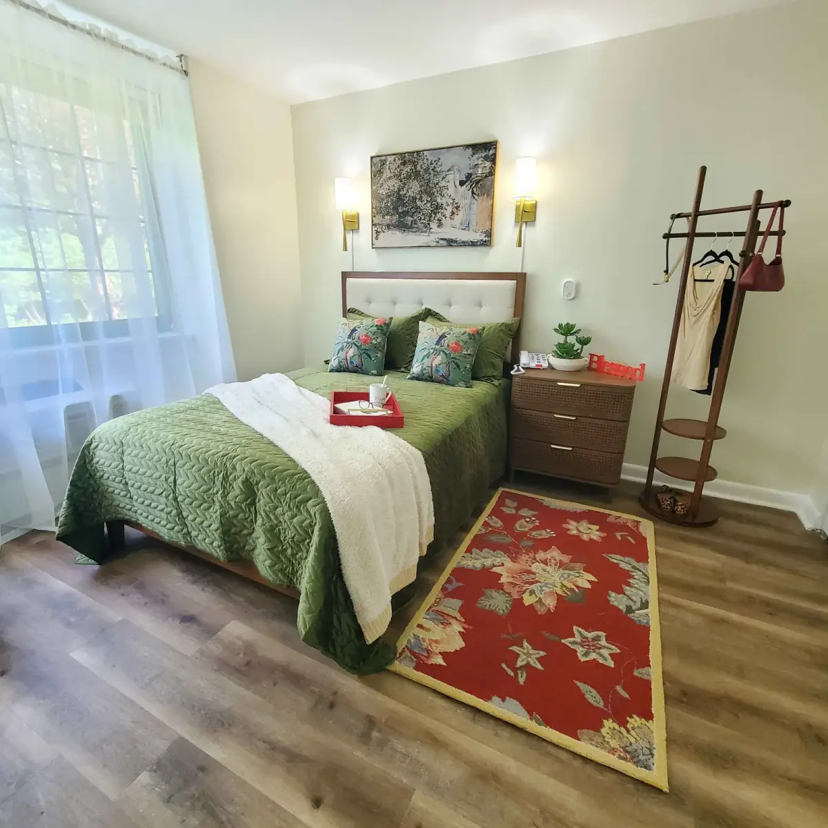 Refined bedroom with botanical accents, brass details, and soft layered bedding — designed by Renata Glaz