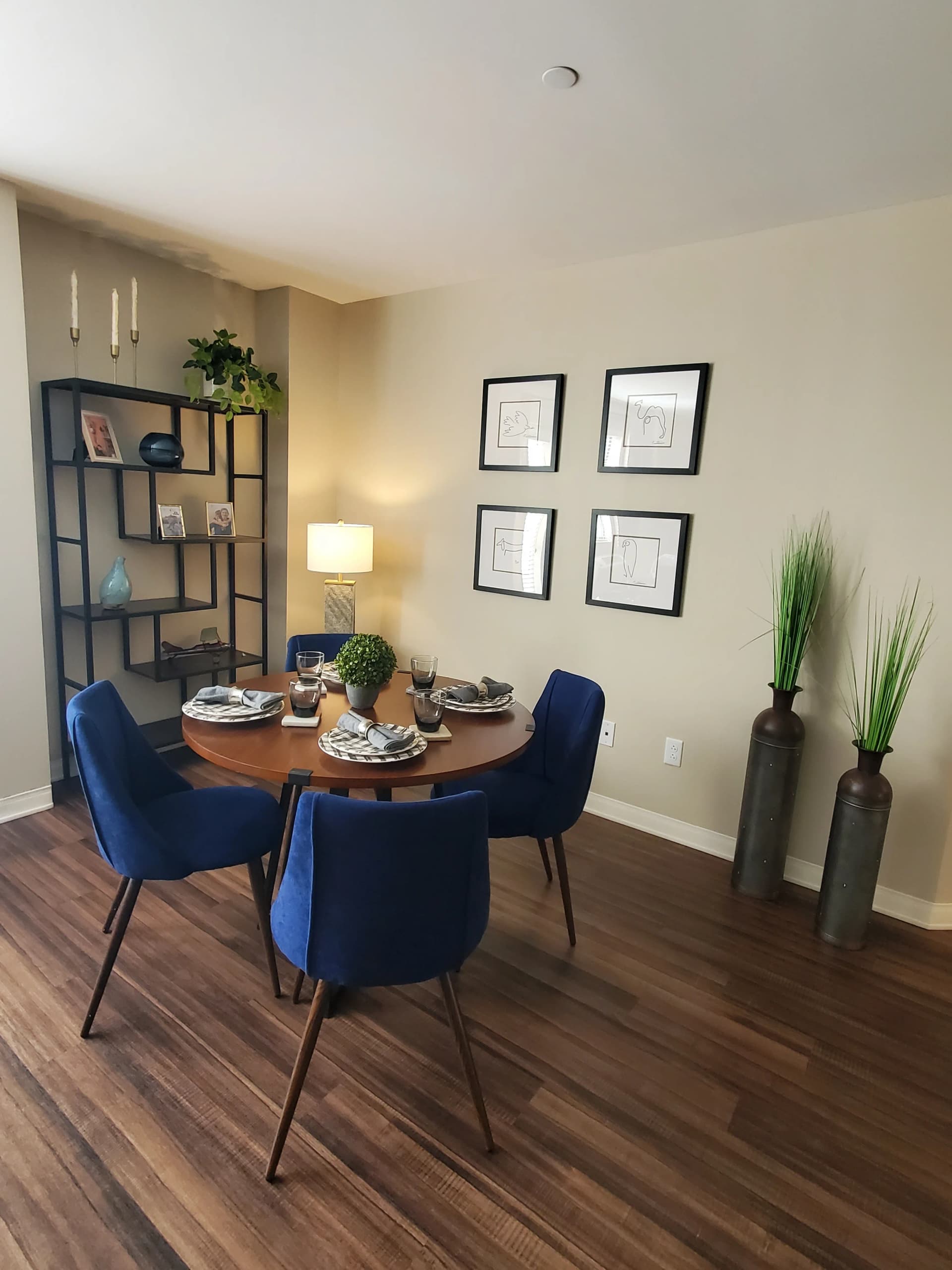 Move-in ready dining area with navy chairs and polished staging details
