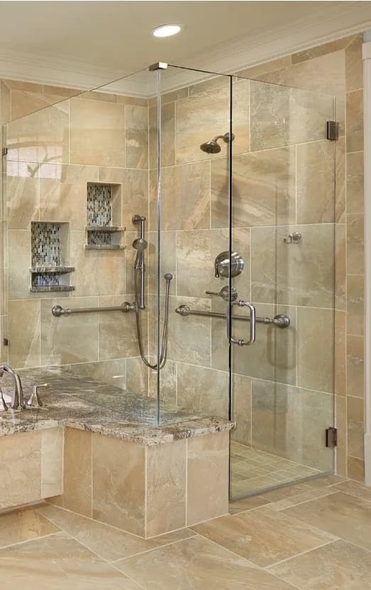 Luxury accessible walk-in shower with marble finishes and thoughtfully integrated grab bars